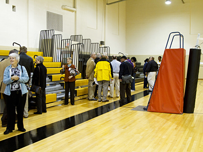 Alumni, parents, and staff examine the renovations to Melton Memorial Gymnasium after the reopening ceremony.