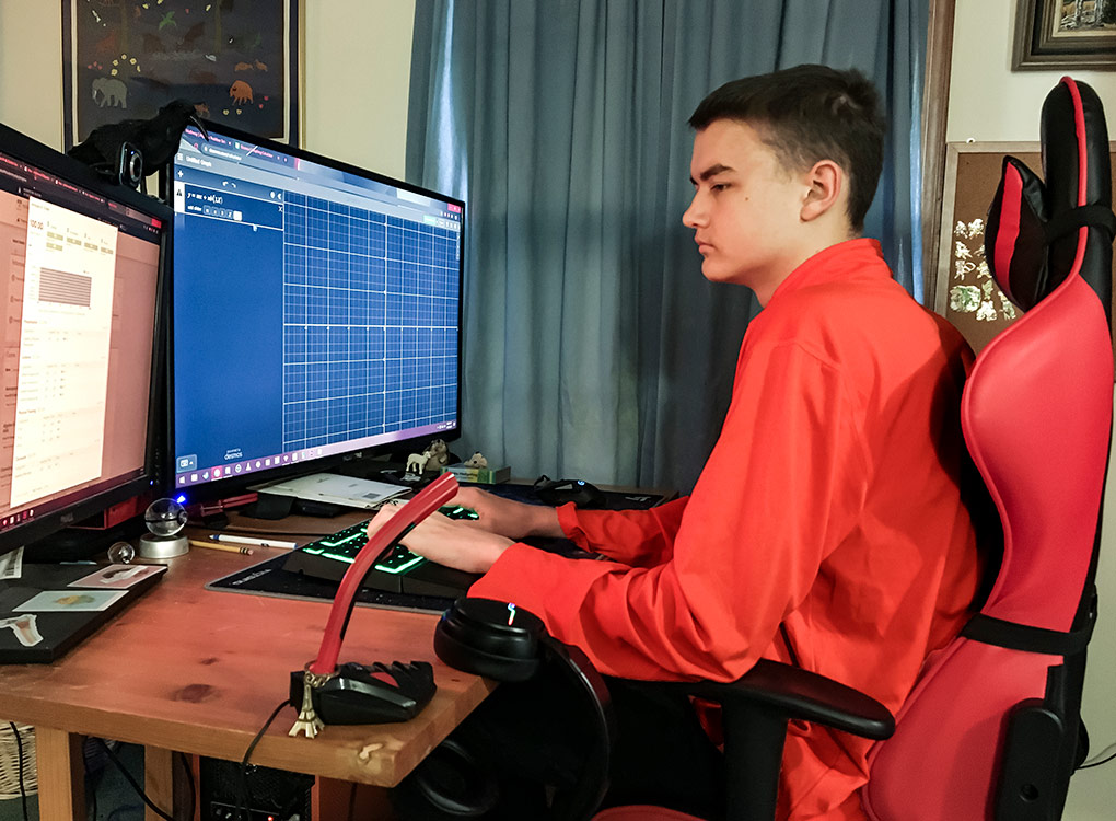 While some students take advantage of R-MA's 1:1 computer program, Peter Babineau '22 takes advantage of his own home computers during the online classes.