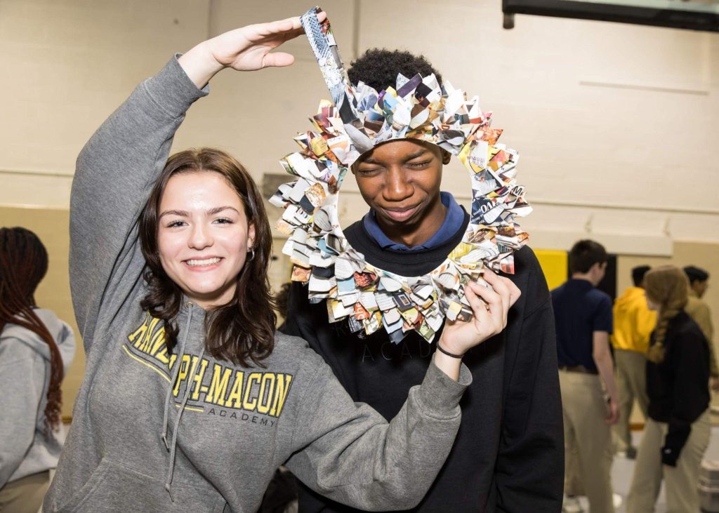 Members of the Interact Club at R-MA being playful, indicating a friendship