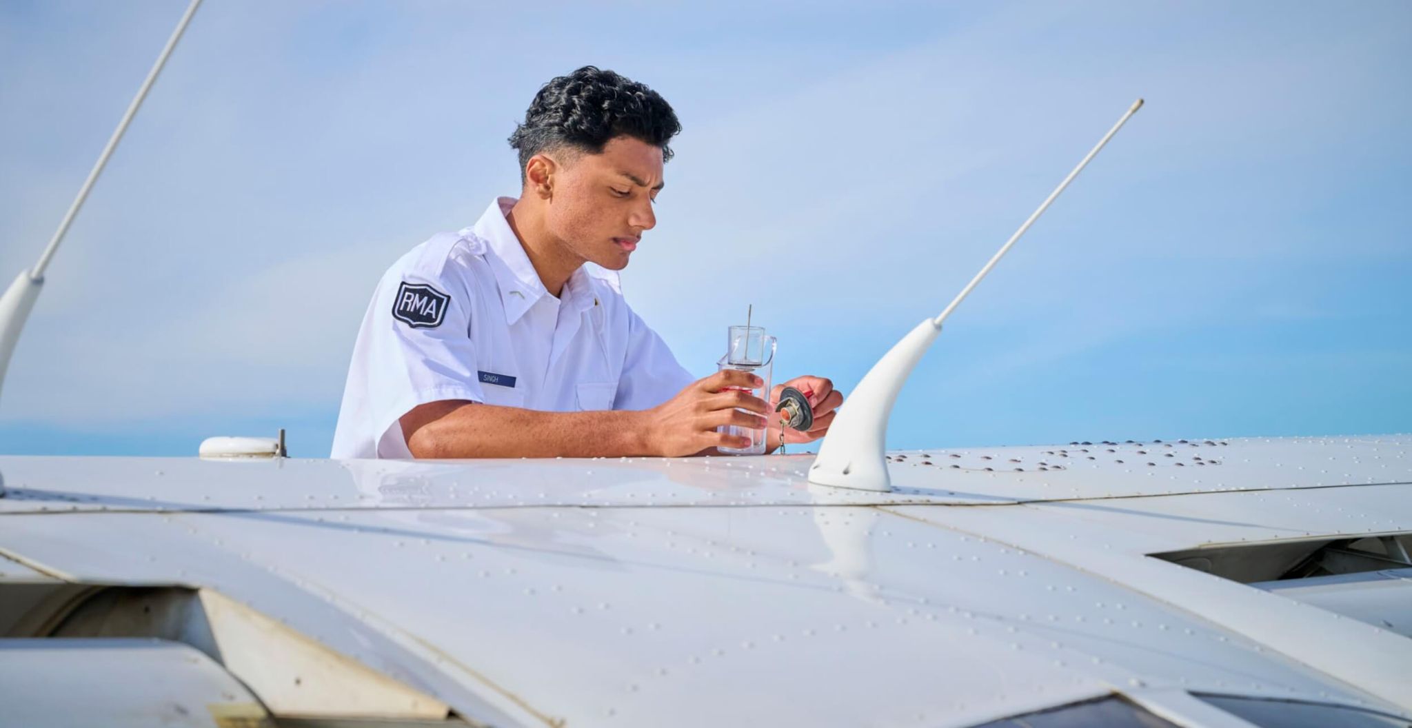 A private school student exploring maintenance procedures during the aviation camp