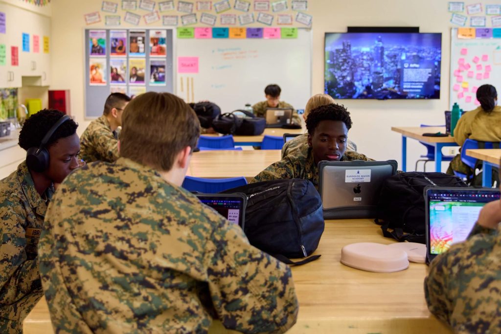 R-MA students studying together in a dorm common area