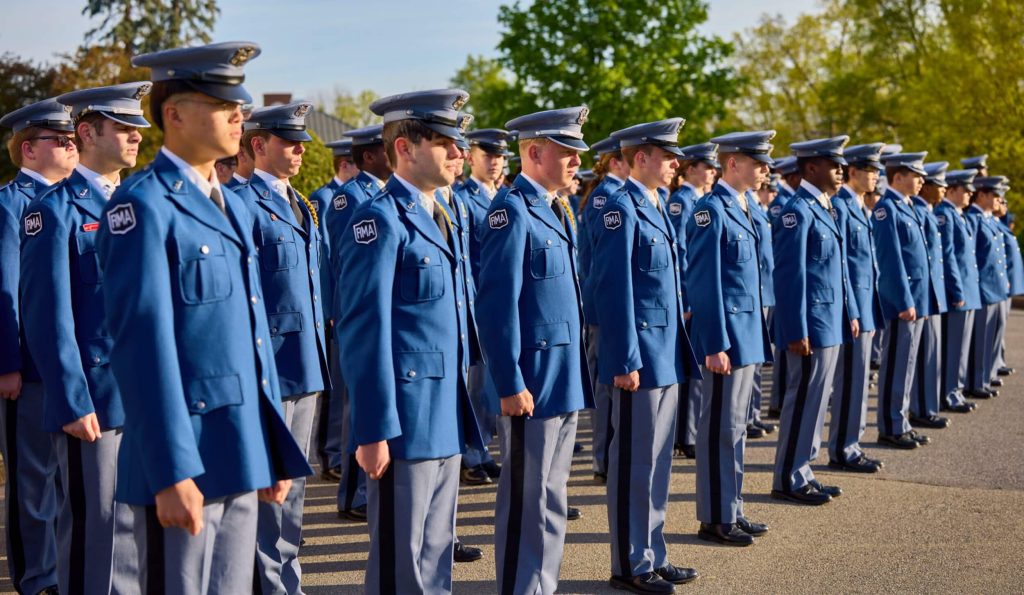 A group of R-MA private boarding school cadets in drill training outdoors