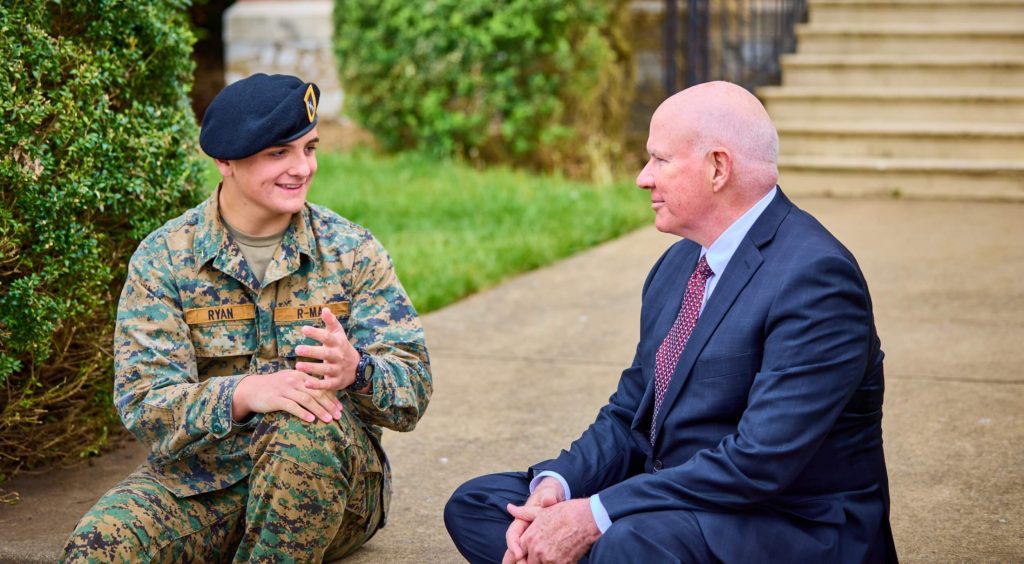 An R-MA cadet receiving academic guidance from an instructor during his military school transfer