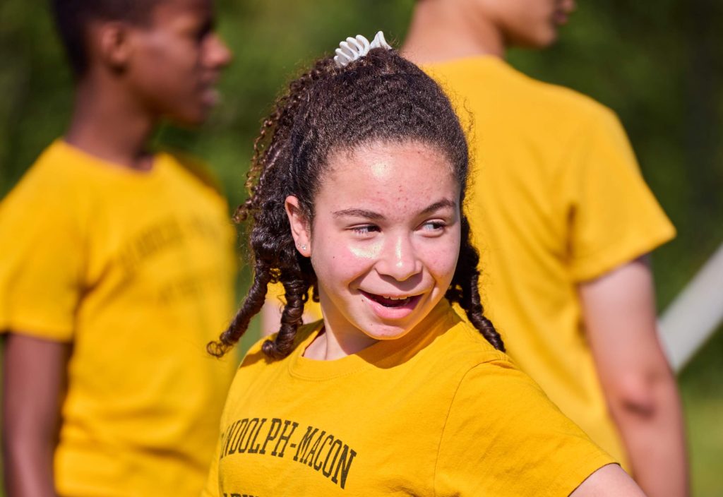 A class of 8th-grade boarding and day school students at R-MA taking part in sporting activities on campus.