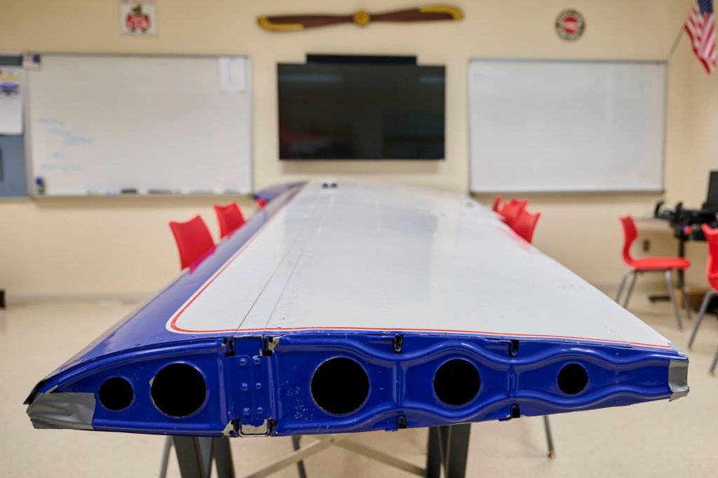 An R-MA classroom featuring an aviation wing used in the private school’s aerospace program.