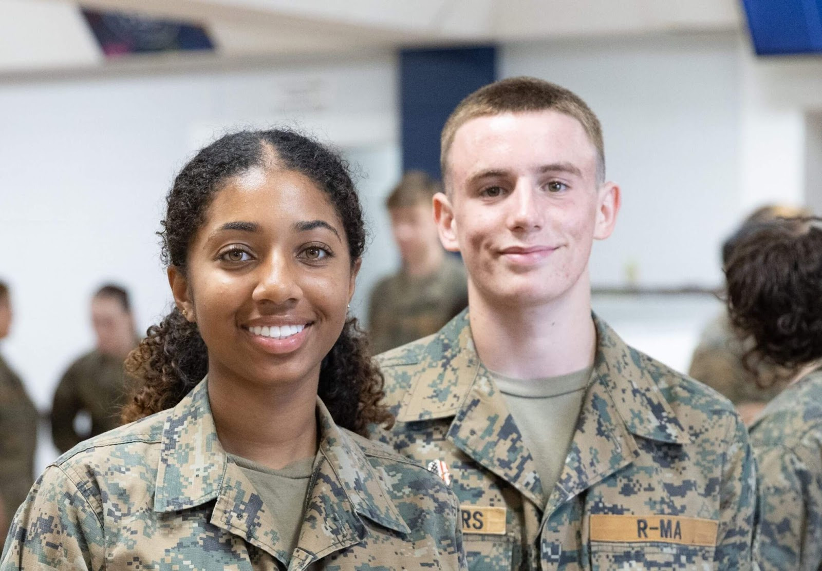 Two cadets in uniform smiling during training while representing modern military concepts at Randolph-Macon Academy