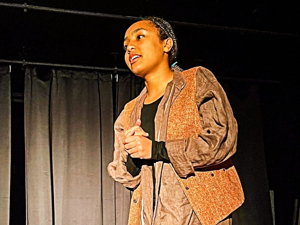 A group of students collaborating in a creative environment, showcasing visual and performing arts at a boarding school