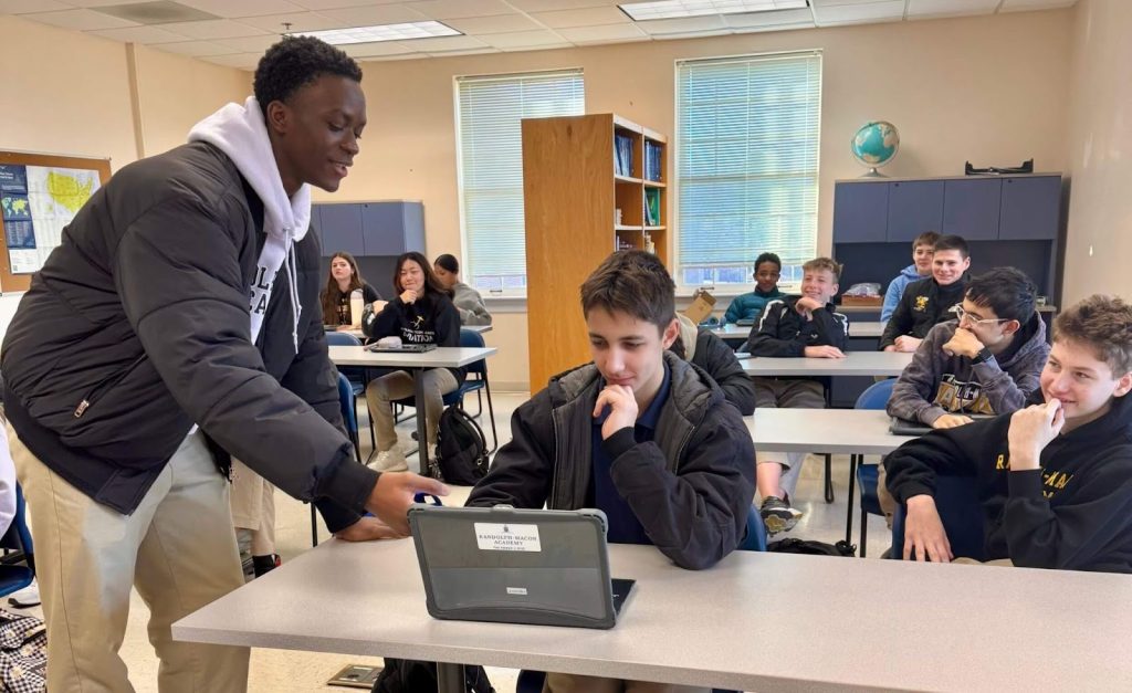 An R-MA student showing kindness and compassion in a classroom setting
