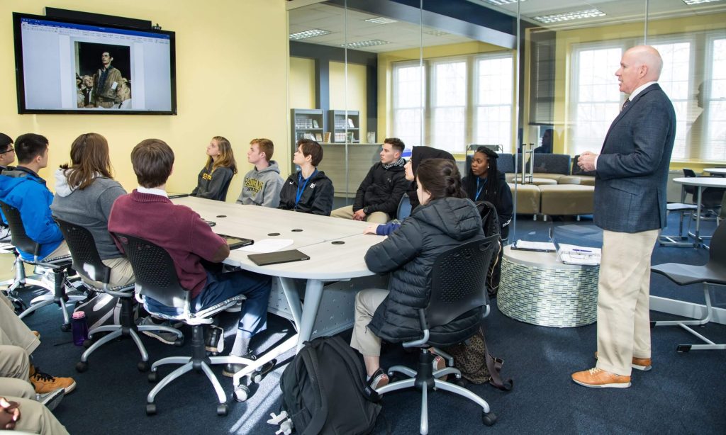 Students participating in a small class discussion at R-MA, demonstrating small class sizes in high school, and personalized learning