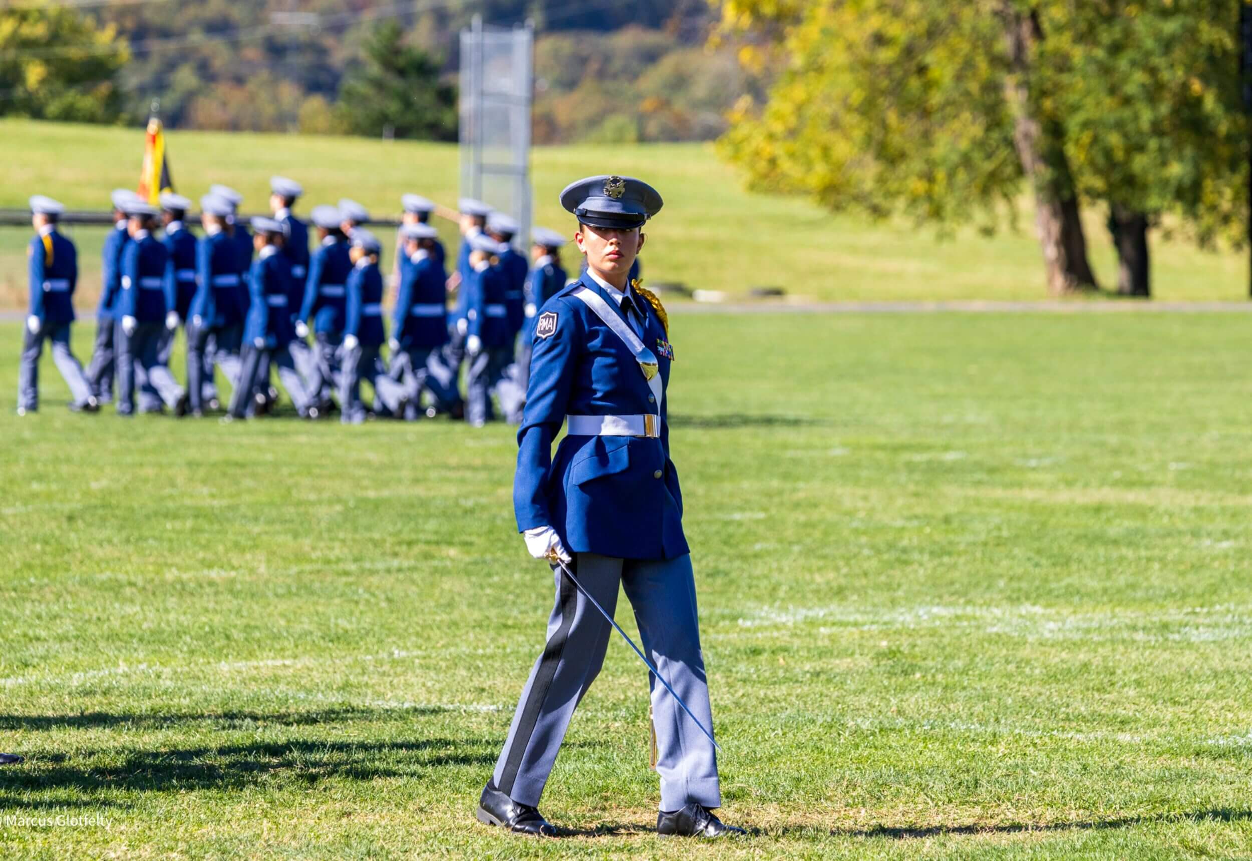 An R-MA cadet leader standing at attention during formation, reflecting discipline, leadership, and values-based education.