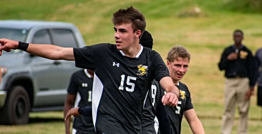 R-MA student athlete leading teammates during a soccer game, demonstrating resilience in high school and character development through sports