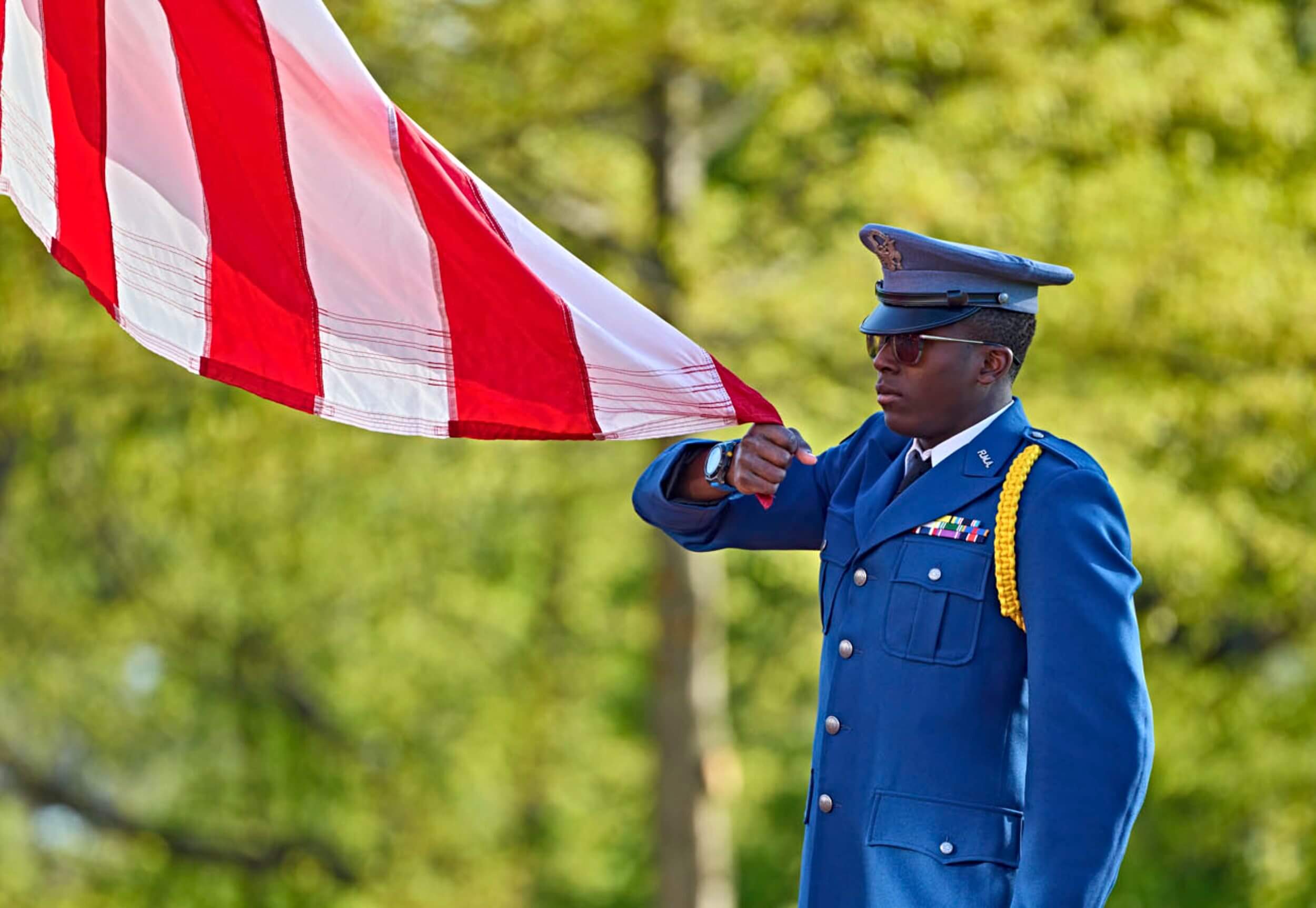 An R-MA cadet participating in a formal leadership ceremony that reflects character development, service-minded leadership, and preparation for public service careers.