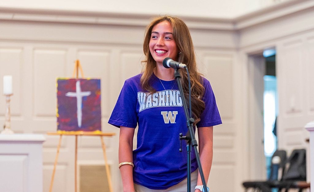An R-MA student announcing her college commitment during Decision Day at a college prep boarding school