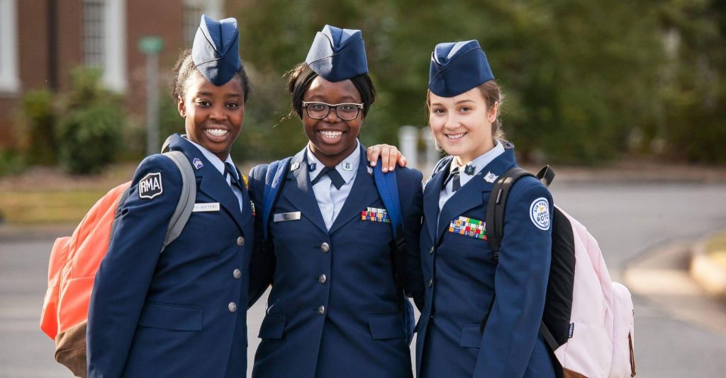 Three Randolph-Macon Academy cadets standing together on campus, reflecting student belonging and private school culture.